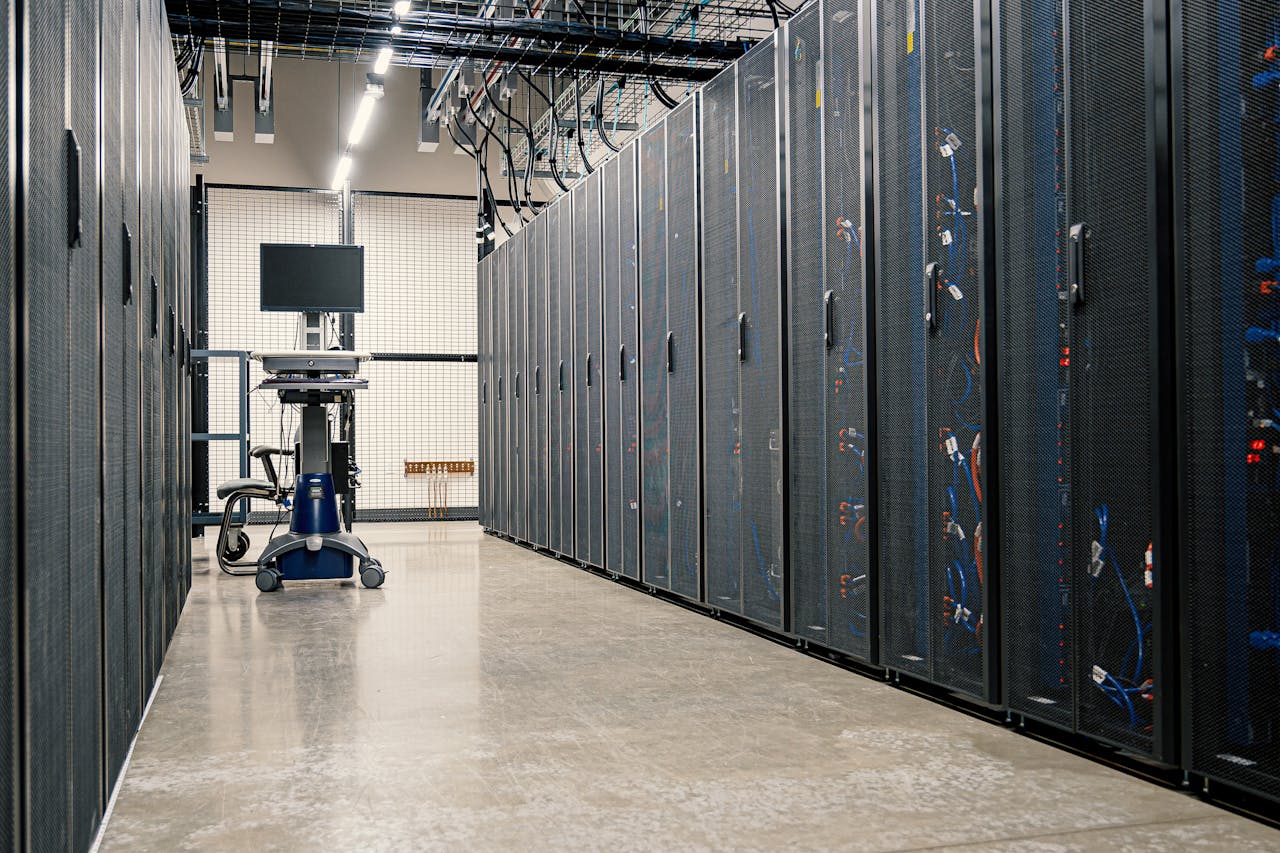 who-we-are Steel framework cabinets housing servers networking devices and cables in contemporary equipped data center